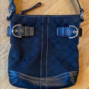 Coach black signature shoulder bag.